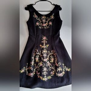 Beautiful black embossed fabric dress with ornate embroidery